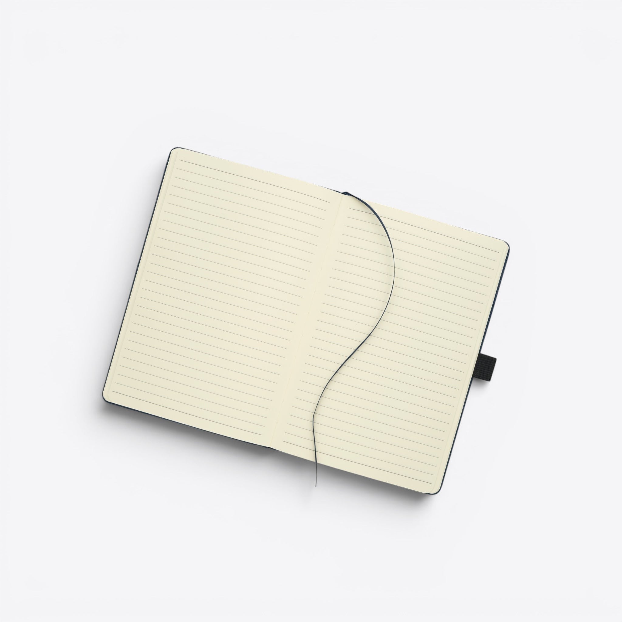 TODAY MERCH black notebook with lined cream pages and a black ribbon bookmark.