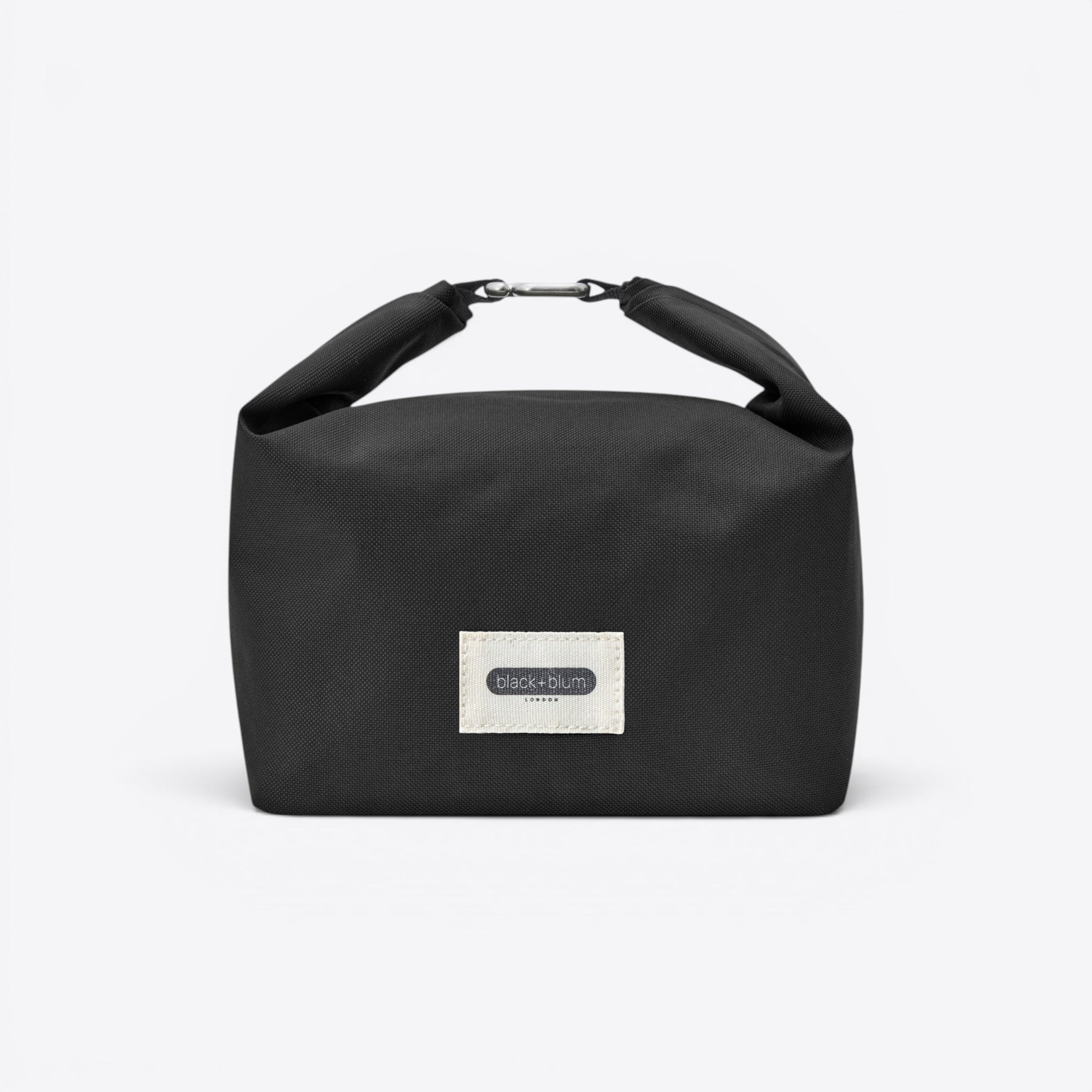 TODAY MERCH black insulated lunch bag with roll-top closure and metal clip. Features a white label with black text.