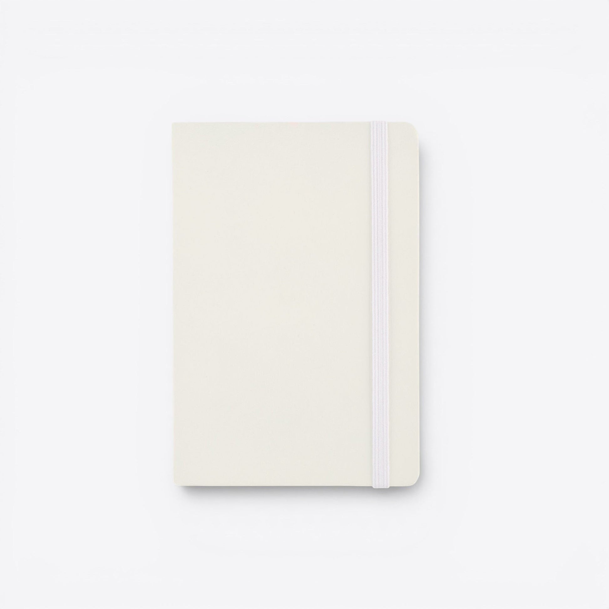 TODAY MERCH cream-colored notebook with integrated pen holder and elastic closure band.