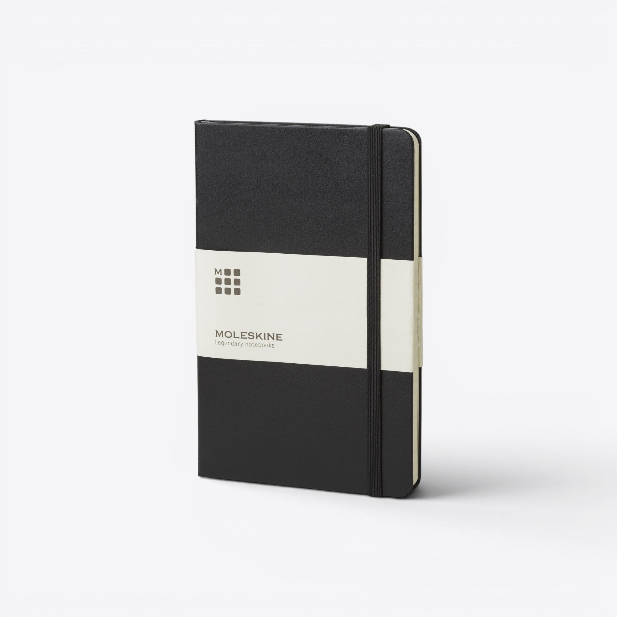 TODAY MERCH Moleskine A5 black hard cover notebook with elastic closure and paper band.