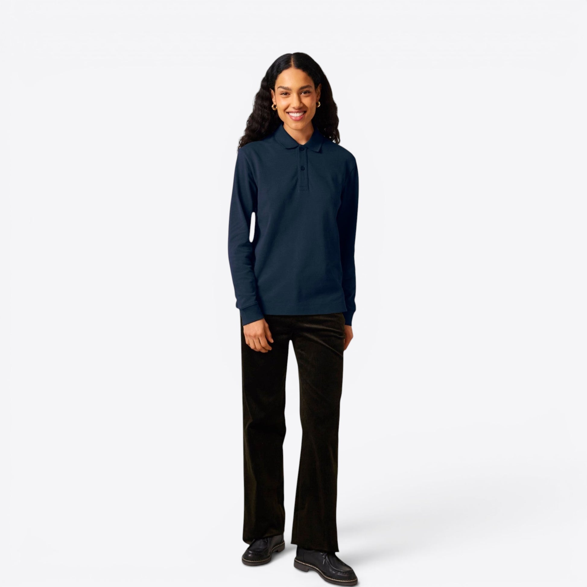 TODAY MERCH navy blue long-sleeve unisex premium polo shirt made of 100% organic cotton, worn by a woman with dark curly hair.