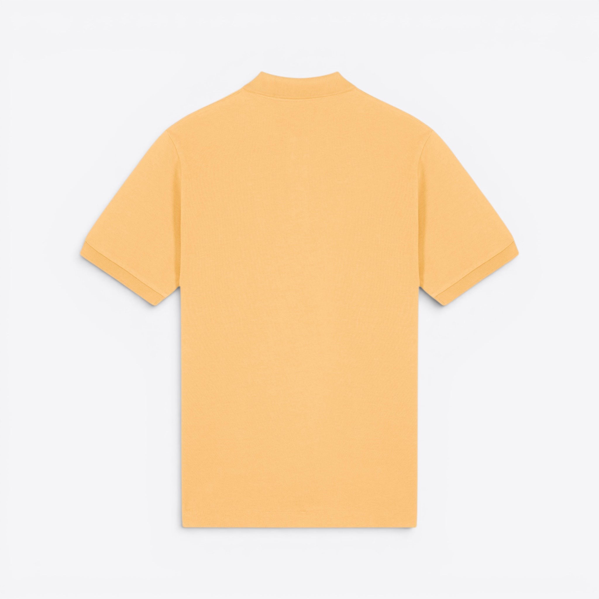 TODAY MERCH unisex premium short-sleeve polo shirt in light orange organic cotton pique.
