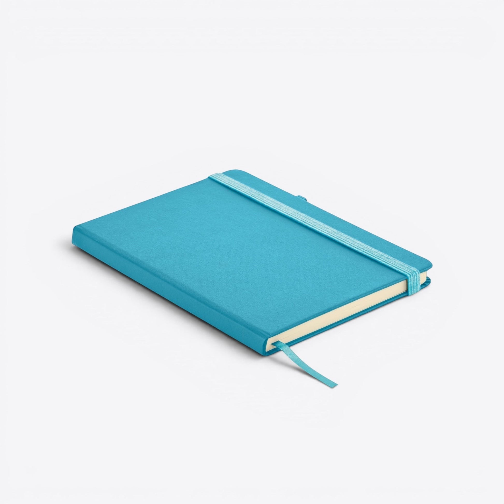 TODAY MERCH turquoise notebook with integrated pen holder and elastic closure. Features a ribbon bookmark.